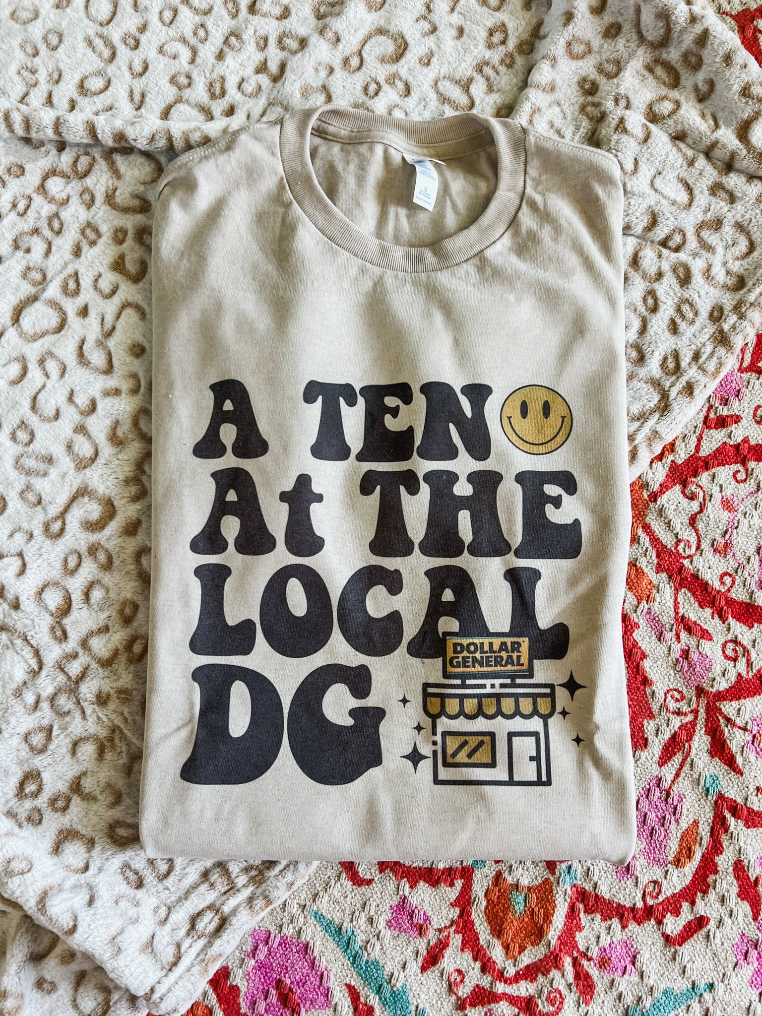 A ten at the local DG store tee