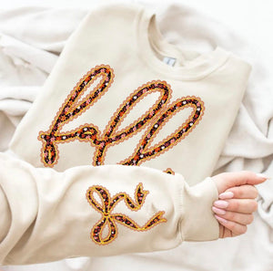 Cursive Fall - sleeve detail tan sweatshirt