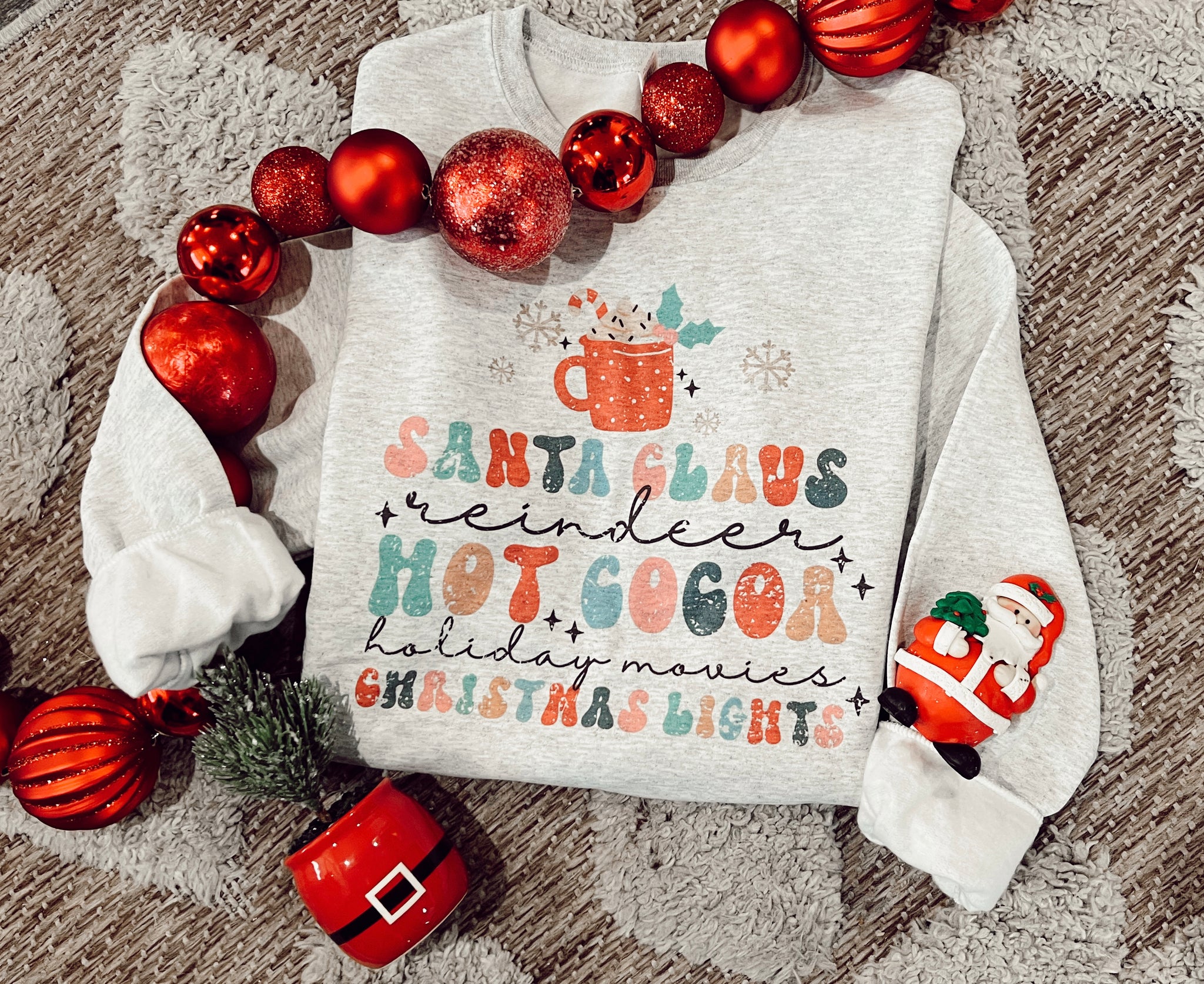 Santa, reindeer, cocoa, holiday morgues & Christmas lights sweater