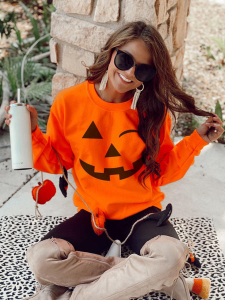 Winking pumpkin face (tee or sweater)