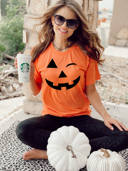 Winking pumpkin face (tee or sweater)